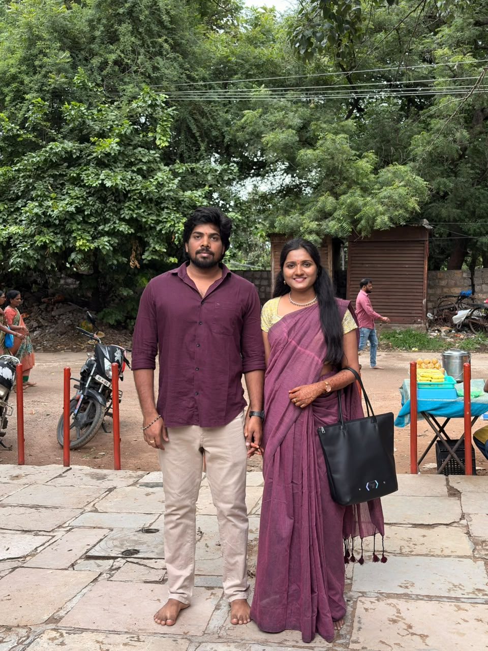 Teja and Lekha standing together outside Chilkur Balaji temple