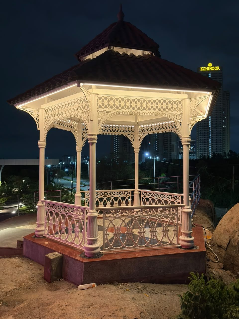 A lit gazebo at night near Durgam Cheruvu, from their evening walk